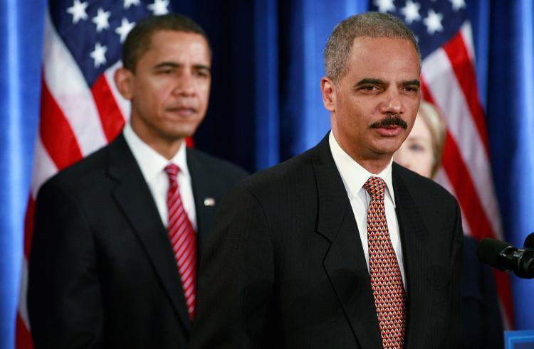 President-elect Barack Obama listens to attorney general-select Eric Holder (R) at a press conference at the Hilton Hotel Dec. 1, 2008. (Scott Olson/Getty Images)