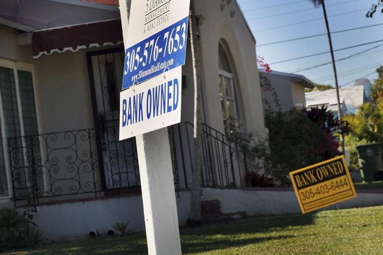 Home foreclosures: A bank owned sign is seen in front of a foreclosed home on December 7, 2010 in Miami, Florida. (Joe Raedle/Getty Images) Home foreclosures: A bank owned sign is seen in front of a foreclosed home on December 7, 2010 in Miami, Florida. (Joe Raedle/Getty Images)