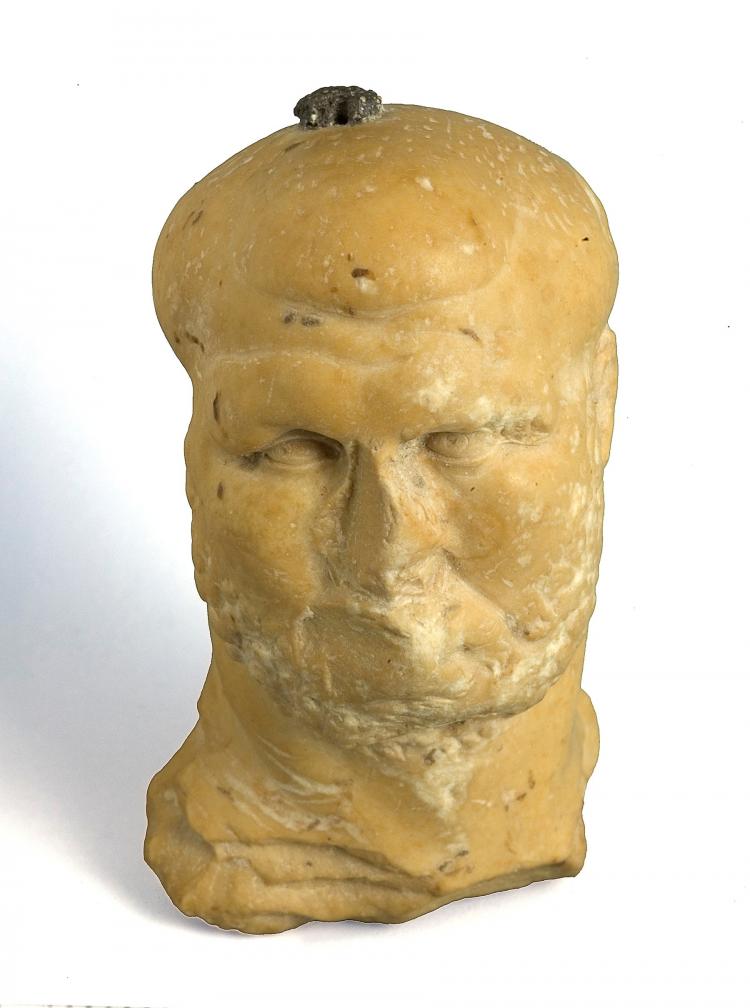 An 1,800 Year old marble figurine in the image of a bearded man, probably that of a Roman boxer, was discovered. (Clara Amit, Israel Antiquities Authority) An 1,800 Year old marble figurine in the image of a bearded man, probably that of a Roman boxer, was discovered. (Clara Amit, Israel Antiquities Authority)