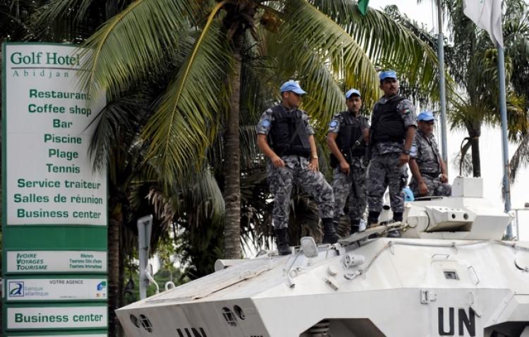 United Nations tanks secure Abidjian's Golf Hotel, where new Ivorian President Alassane Ouattara set his headquarters, on Dec. 8. With Laurent Gbagbo and Alassane Ouattara claiming the presidency after disputed polls, Ouattara's side pushed on with his pr (Issouf Sanogo/AFP/Getty Images ) United Nations tanks secure Abidjian's Golf Hotel, where new Ivorian President Alassane Ouattara set his headquarters, on Dec. 8. With Laurent Gbagbo and Alassane Ouattara claiming the presidency after disputed polls, Ouattara's side pushed on with his pr (Issouf Sanogo/AFP/Getty Images )