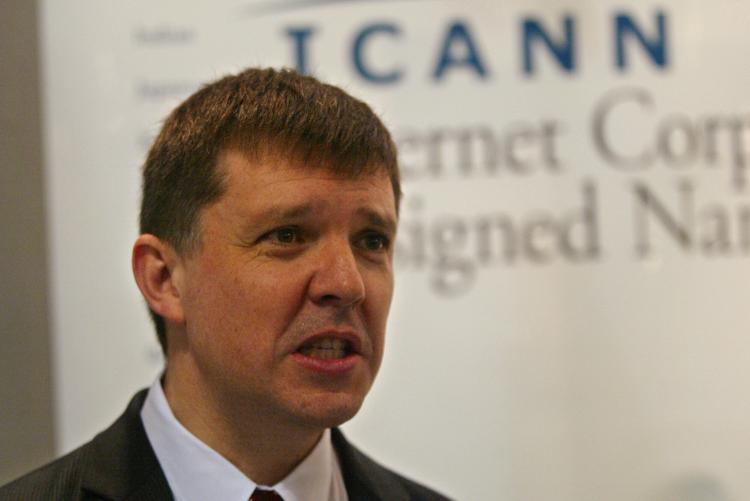 In this file photo, Internet Corporation for Assigned Names and Numbers (Icann) CEO Paul Twomey answers a visitor's question at the Icann stand of the World Summit on the Internet Society (WSIS). Icann has approved non-Latin languages for use in domain na (Abdelhak Senna/AFP/Getty Images) In this file photo, Internet Corporation for Assigned Names and Numbers (Icann) CEO Paul Twomey answers a visitor's question at the Icann stand of the World Summit on the Internet Society (WSIS). Icann has approved non-Latin languages for use in domain na (Abdelhak Senna/AFP/Getty Images)