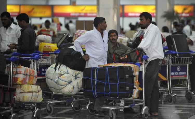 Foreign travelers wait with their luggage for information on Air India flights at the Indira Gandhi International Airport in New Delhi on May 26, 2010. (Raveendran/AFP/Getty Images) Foreign travelers wait with their luggage for information on Air India flights at the Indira Gandhi International Airport in New Delhi on May 26, 2010. (Raveendran/AFP/Getty Images)