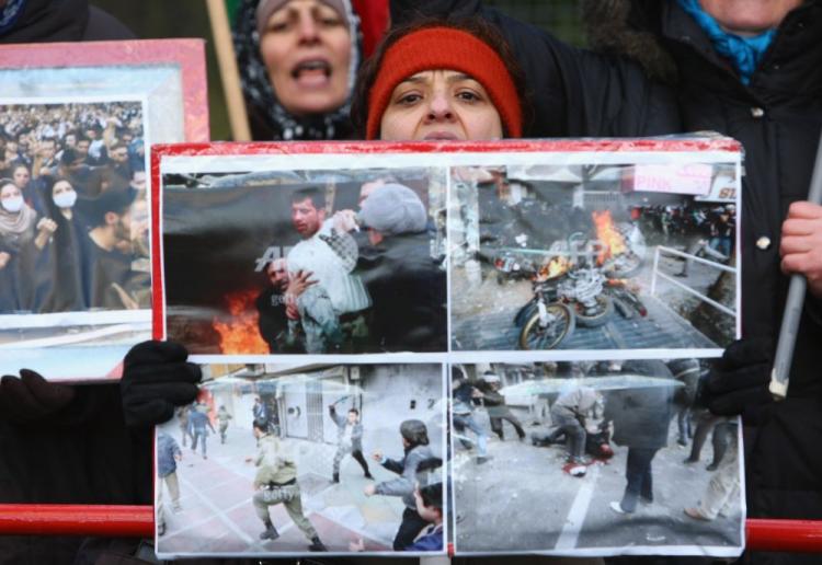 Women hold photographs showing scenes from recent violent, anti-government demonstrations in Tehran while protesting outside the Iranian embassy on December 28, 2009 in Berlin, Germany. (Sean Gallup/Getty Images) Women hold photographs showing scenes from recent violent, anti-government demonstrations in Tehran while protesting outside the Iranian embassy on December 28, 2009 in Berlin, Germany. (Sean Gallup/Getty Images)