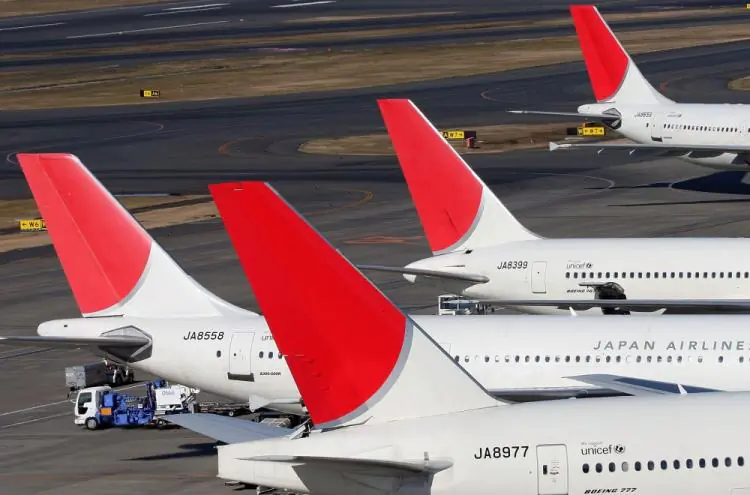 Japan Airlines (JAL) passenger planes sit on the tarmac of Tokyo International Airport in Tokyo, Japan  on Jan. 6, 2010. (Koichi Kamoshida/Getty Images)
