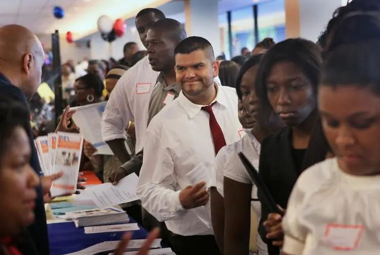 Job seekers speak with recruiters during a career fair at Malcolm X College on June 23, 2018 in Chicago, Illinois. (Scott Olson/Getty Images)
