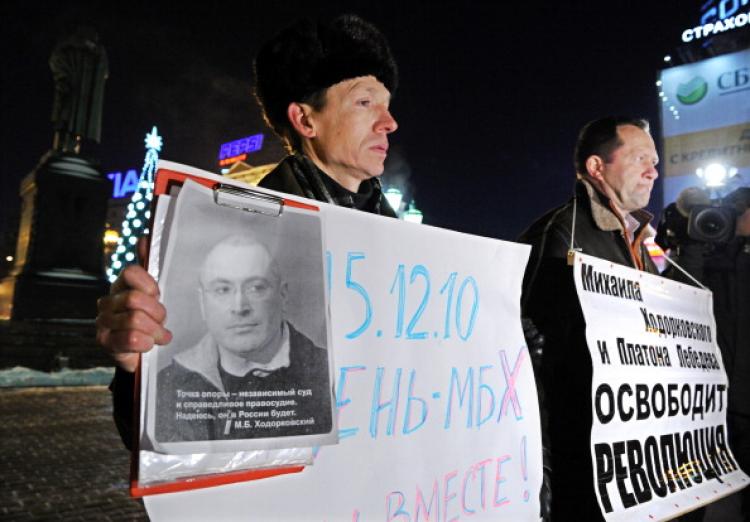 Two men hold a picture of jailed Russian tycoon Mikhail Khodorkovsky and posters reading '15.12.10 is a day of MBH (initials of Mikhail Borisovich Khodotkovsky). We are together!' (Yuri Kadobnov/AFP/Getty Images) Two men hold a picture of jailed Russian tycoon Mikhail Khodorkovsky and posters reading '15.12.10 is a day of MBH (initials of Mikhail Borisovich Khodotkovsky). We are together!' (Yuri Kadobnov/AFP/Getty Images)