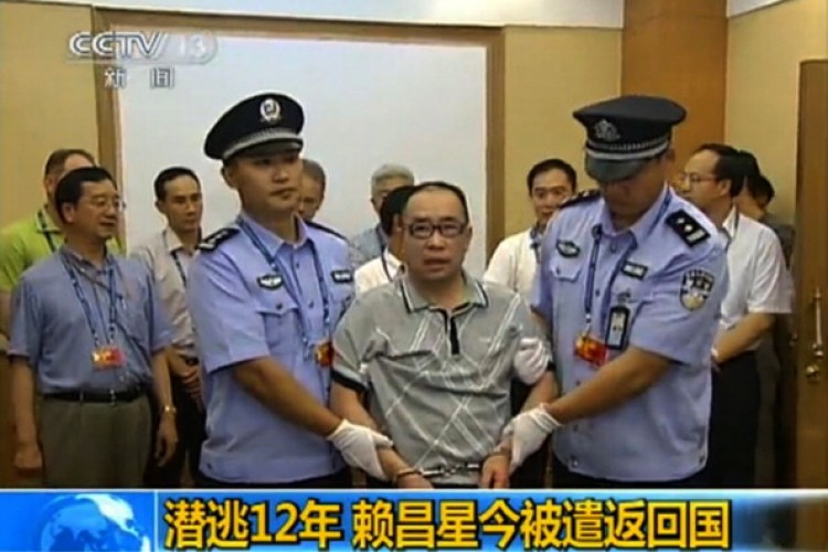 This TV grab, taken on July 23, 2011 from China's Central Television, shows fugitive Chinese businessman Lai Changxing escorted by Chinese authorities after he landed in Beijing aboard a civilian flight in the custody of Canadian police. (STR/AFP/Getty Images) This TV grab, taken on July 23, 2011 from China's Central Television, shows fugitive Chinese businessman Lai Changxing escorted by Chinese authorities after he landed in Beijing aboard a civilian flight in the custody of Canadian police. (STR/AFP/Getty Images)