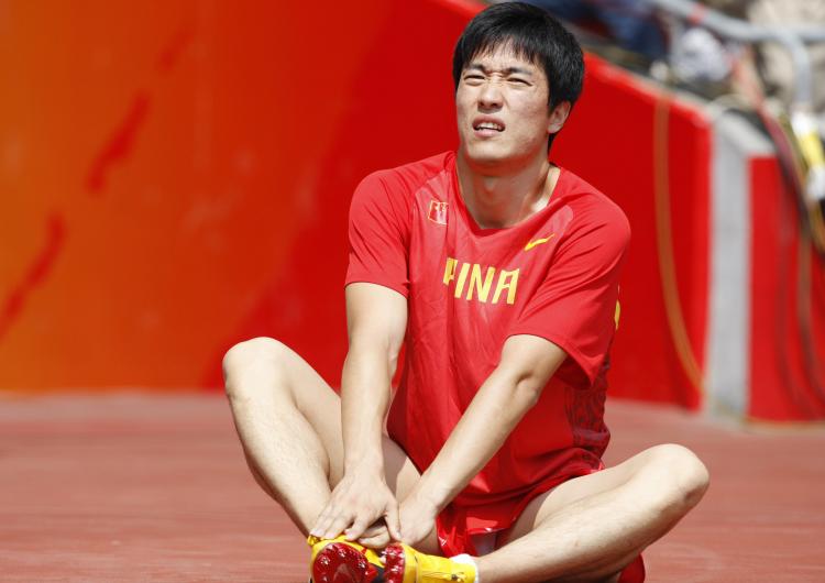 Questions about Liu Xiang's withdrawal from the men's 100m hurdles center around his reaction, the reaction from his coach, national sporting body's and the Chinese regime.  (Adrian Dennis/AFP/Getty Images)