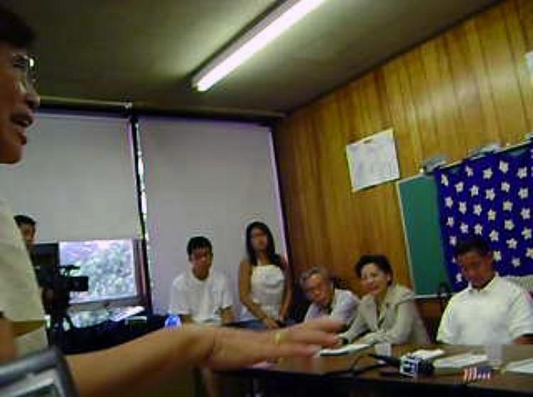 New York Councilman John Liu (right) plays with his cell phone while Taiwanese American Mr. Wang Suhua speaks at the August 18 meeting. (The Epoch Times) New York Councilman John Liu (right) plays with his cell phone while Taiwanese American Mr. Wang Suhua speaks at the August 18 meeting. (The Epoch Times)