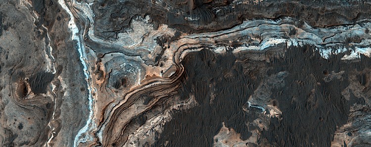Layered rocky outcrop in Ladon Valles, an outflow channel on Mars. (NASA/JPL/University of Arizona)