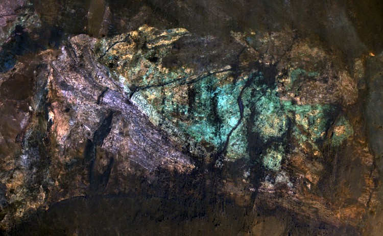 The color variations in these rocks were probably caused by water activity in the red planet's early history. (NASA/JPL/University of Arizona)
