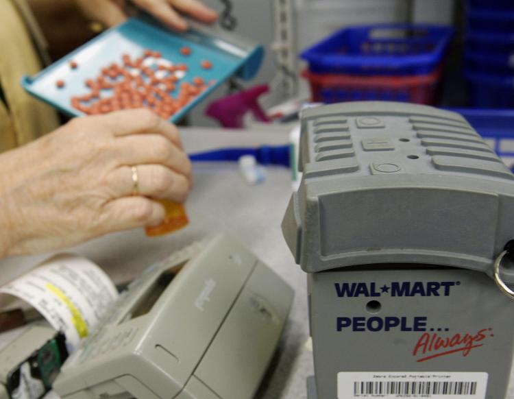 Medicaid budget gaps will force restrictions and cuts on services and coverage, a report on Thursday said. Pictured above, a Wal-Mart pharmacist fills prescription drug orders at a store in Florida. (Robert Sullivan/AFP/Getty Images) Medicaid budget gaps will force restrictions and cuts on services and coverage, a report on Thursday said. Pictured above, a Wal-Mart pharmacist fills prescription drug orders at a store in Florida. (Robert Sullivan/AFP/Getty Images)