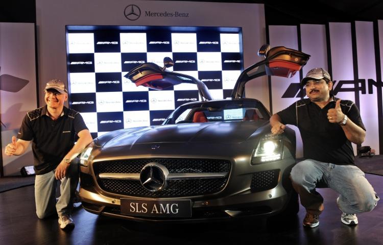 Managing Director and CEO of Mercedes-Benz India Wilfried Aulbur (L) and MD Sales and Marketing, Debashish Mitra pose with the new Mercedes-Benz SLS AMG luxury sports car during its launch in New Delhi on July 16. (Prakash Singh/AFP/Getty Images) Managing Director and CEO of Mercedes-Benz India Wilfried Aulbur (L) and MD Sales and Marketing, Debashish Mitra pose with the new Mercedes-Benz SLS AMG luxury sports car during its launch in New Delhi on July 16. (Prakash Singh/AFP/Getty Images)
