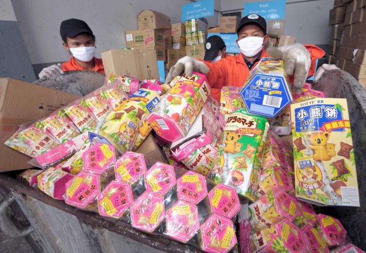 GOT MELAMINE? Thai officials fill snacks and food products tainted with the toxic chemical melamine in a container prior to destruction in Ayutthaya, the capital city of Ayutthaya province on Nov. 10. (Pornchai Kittiwongsakula/AFP/Getty Images) GOT MELAMINE? Thai officials fill snacks and food products tainted with the toxic chemical melamine in a container prior to destruction in Ayutthaya, the capital city of Ayutthaya province on Nov. 10. (Pornchai Kittiwongsakula/AFP/Getty Images)