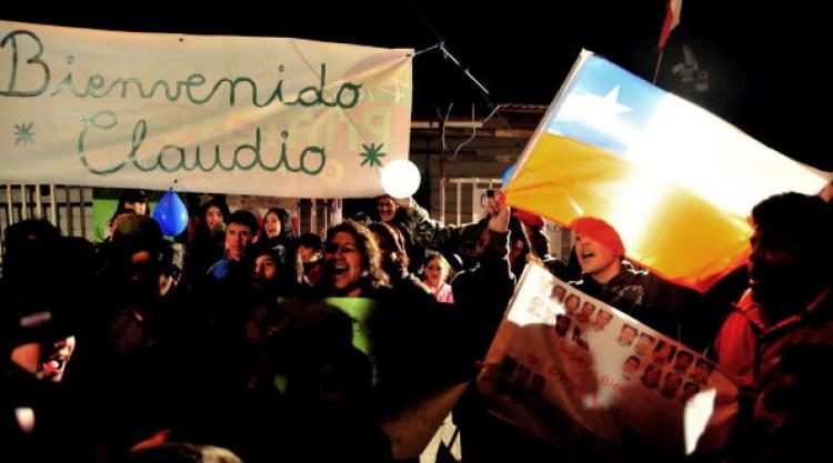 Relatives and friends of miner Claudio Yanez wait for his exit from the hospital the day after the miners' rescue, in Copiapo, 800 km north of Santiago, on October 14, 2010.  (Ariel Marinkovic/AFP/Getty Images)