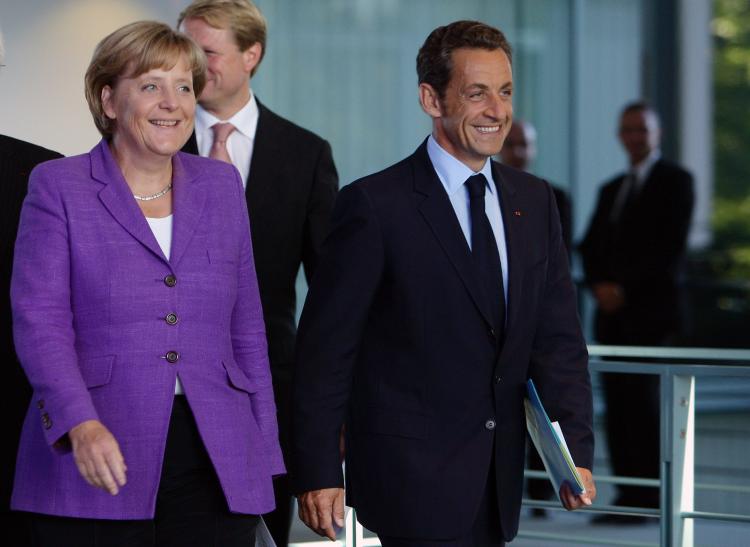 French President Nicolas Sarkozy and German Chancellor Angela Merkel arrive for a news conference at the Chancellery on August 31, 2009 in Berlin, Germany. (Andreas Rentz/Getty Images) French President Nicolas Sarkozy and German Chancellor Angela Merkel arrive for a news conference at the Chancellery on August 31, 2009 in Berlin, Germany. (Andreas Rentz/Getty Images)