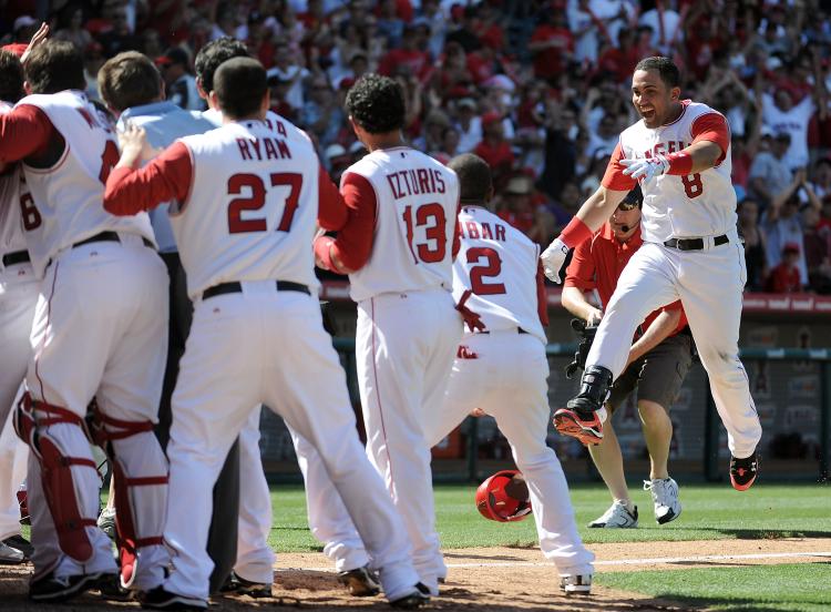 BE CAREFUL: Kendry Morales (right) landed awkwardly in his game-winning home run celebration, breaking his leg. (Harry How/Getty Images) BE CAREFUL: Kendry Morales (right) landed awkwardly in his game-winning home run celebration, breaking his leg. (Harry How/Getty Images)