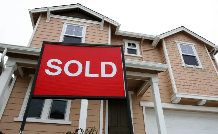 A sold sign is posted in front of a home in a new housing development in San Francisco, in this file photo. (Justin Sullivan/Getty Images)