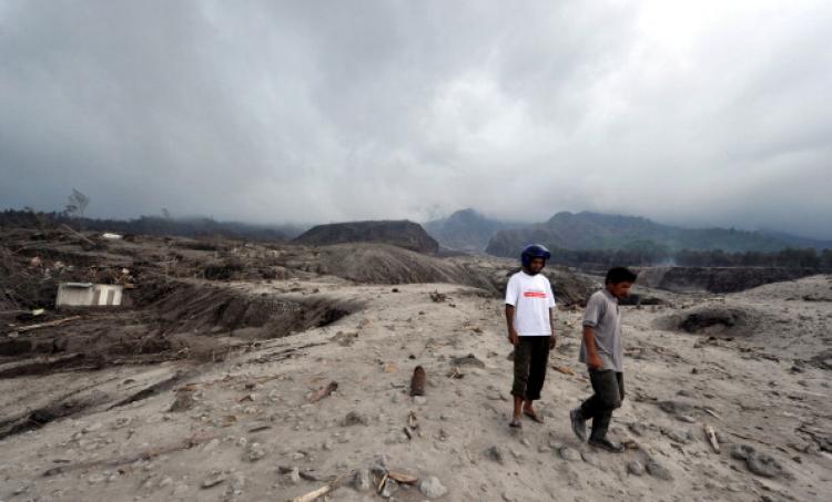 Former residents walk amongst the remains of the village of Kali Adem in Sleman on October 28, 2010 after the area was devastated by the eruption of Mount Merapi volcano on October 26. (Adek Berry/AFP/Getty Images) Former residents walk amongst the remains of the village of Kali Adem in Sleman on October 28, 2010 after the area was devastated by the eruption of Mount Merapi volcano on October 26. (Adek Berry/AFP/Getty Images)
