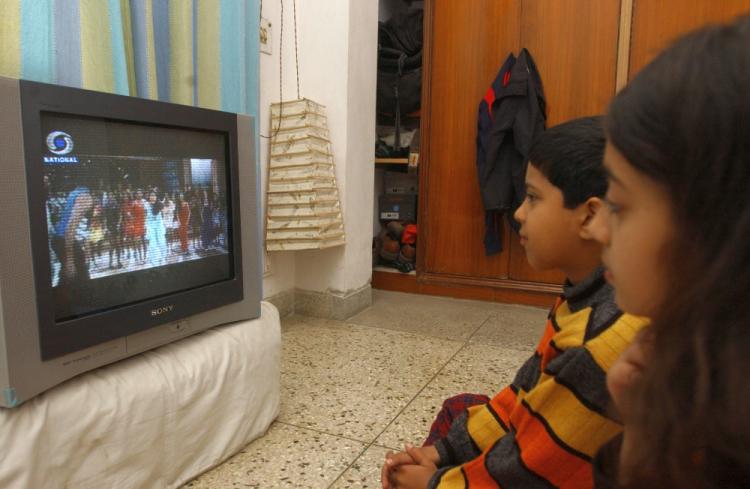 A Nielsen Ratings report from last December showed that kids between the ages of 2 and 11 log an average of 25 hours of television per week. (Manpreet Romana/AFP/Getty Images) A Nielsen Ratings report from last December showed that kids between the ages of 2 and 11 log an average of 25 hours of television per week. (Manpreet Romana/AFP/Getty Images)