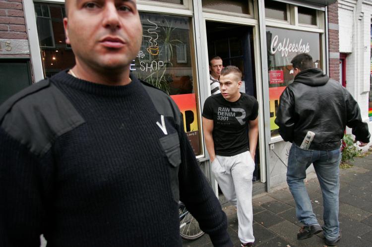 A bouncer (L) stands outside a coffee shop in Rosendaal, Netherlands on November 19, 2008. (Anoek de Groot/AFP/Getty Images) A bouncer (L) stands outside a coffee shop in Rosendaal, Netherlands on November 19, 2008. (Anoek de Groot/AFP/Getty Images)