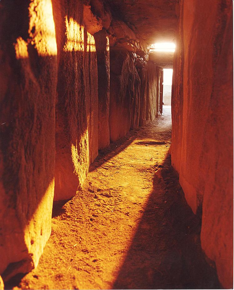 The passage way alight with the Winter Solstice sun at Newgrange, County Meath, Ireland (Courtesy of The Office of Public Works, Ireland)