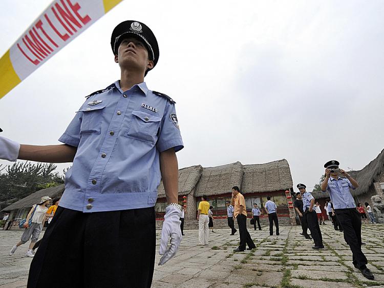 Chinese policemen cordon off a park where they kept detained pro-Tibet demonstrators near the main Olympic stadium in Beijing on August 13, 2008. (Jewel Samad/AFP/Getty Images) Chinese policemen cordon off a park where they kept detained pro-Tibet demonstrators near the main Olympic stadium in Beijing on August 13, 2008. (Jewel Samad/AFP/Getty Images)
