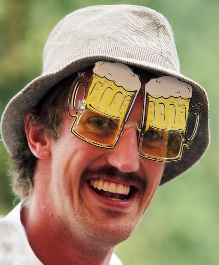 A visitor smiles as he wears beer glasses during the opening day of the Oktoberfest on Sept. 18 in Munich, Germany. 2010 marks the 200th anniversary of Oktoberfest. (Alexandra Beier/Getty Images) A visitor smiles as he wears beer glasses during the opening day of the Oktoberfest on Sept. 18 in Munich, Germany. 2010 marks the 200th anniversary of Oktoberfest. (Alexandra Beier/Getty Images)