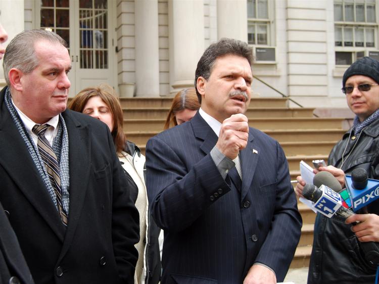 State Assemblyman Felix Ortiz (C) spoke from the steps of City Hall on Sunday to propose legislation that would require people that have restraining orders against them to wear GPS tracking devices. (Catherine Yang/The Epoch Times) State Assemblyman Felix Ortiz (C) spoke from the steps of City Hall on Sunday to propose legislation that would require people that have restraining orders against them to wear GPS tracking devices. (Catherine Yang/The Epoch Times)