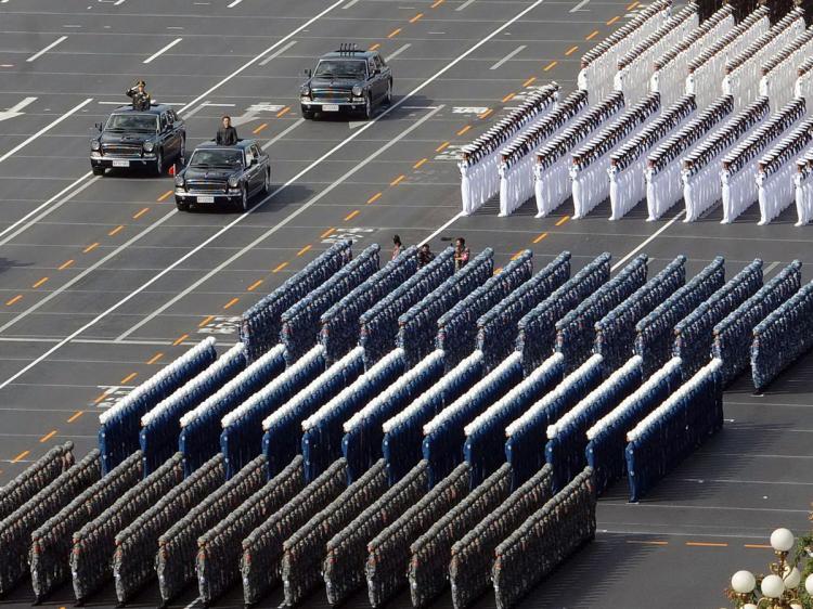 Chinese President Hu Jintao (3L car) reviews the military personnel during the National Day parade in Beijing on October 1, 2009. (AFP/AFP/Getty Images) Chinese President Hu Jintao (3L car) reviews the military personnel during the National Day parade in Beijing on October 1, 2009. (AFP/AFP/Getty Images)