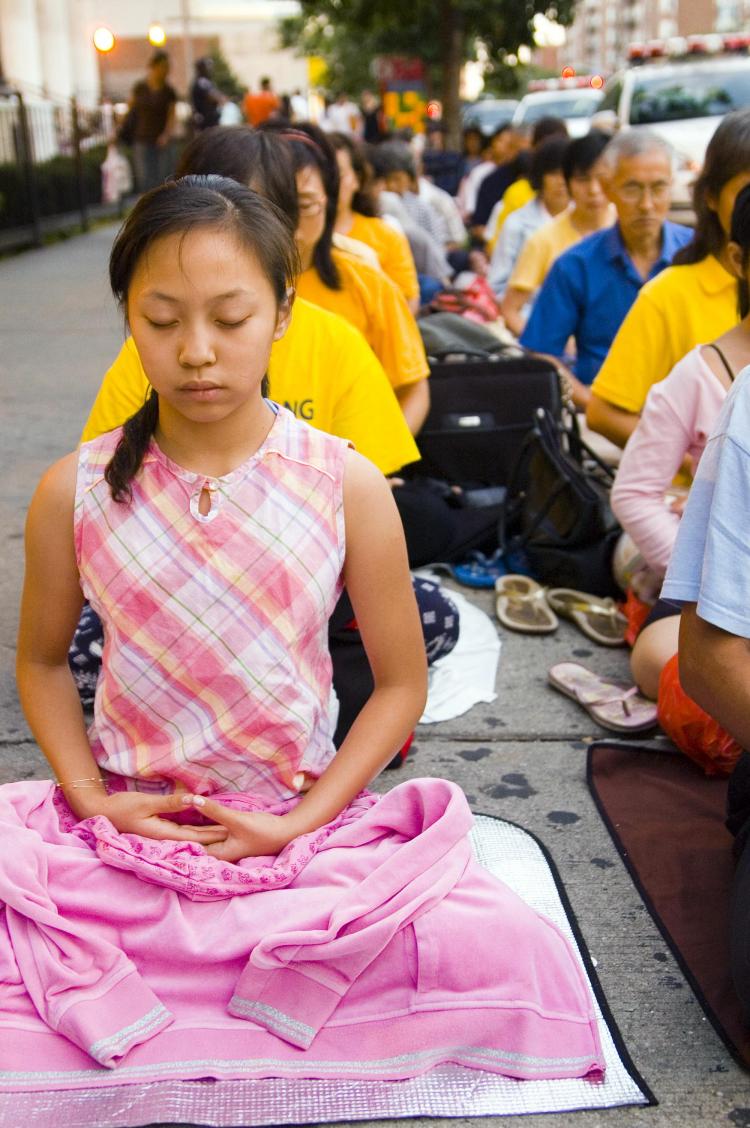 PEACEFUL PROTEST: Falun Gong practitioners gathered in Flushing for a peaceful protest of the recent attacks against them and their beliefs (JOSHUA PHILIPP/THE EPOCH TIMES)