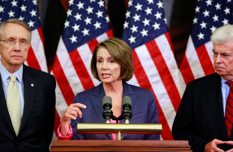 House Speaker Nancy Pelosi (D-CA), joined by Senate Majority Leader Harry Reid (D-NV) and Housing and Urban Affairs Committee Chairman Christopher Dodd (D-CT), addresses reporters on the progress of the federal bailout bill on Sunday, Sept. 28. (Chip Somodevilla/Getty Images)
