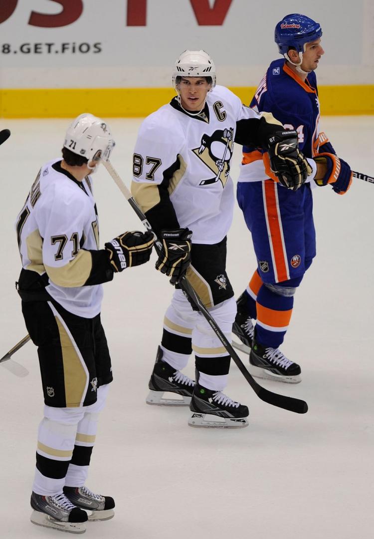 Evgeni Malkin (left) and Sidney Crosby (right) haven&lsquo;t had to be superstars for the Penguins to do well this year.  (Paul Bereswill/Getty Images)
