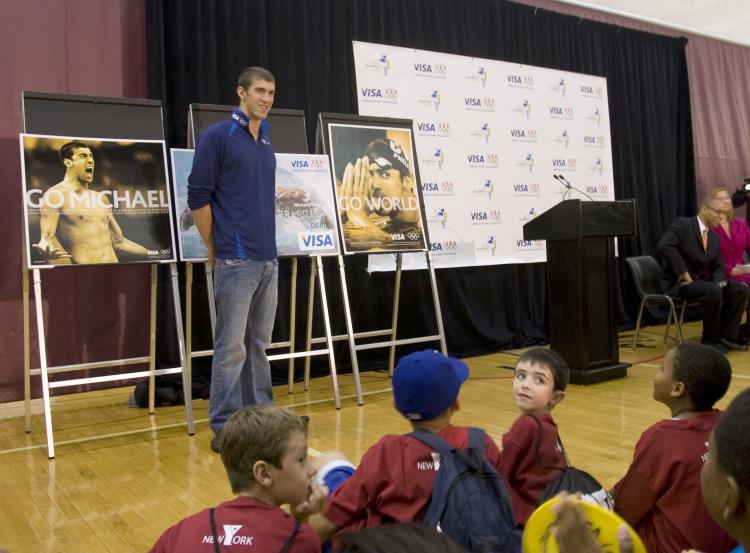 SWIMMING TREND: Michael Phelps, 14-time Olympic gold medalist, glad to be back on American soil. He and Visa Inc. together funded $20,000 in programs for young swimmers. (Helena Zhu The Epoch Times) SWIMMING TREND: Michael Phelps, 14-time Olympic gold medalist, glad to be back on American soil. He and Visa Inc. together funded $20,000 in programs for young swimmers. (Helena Zhu The Epoch Times)