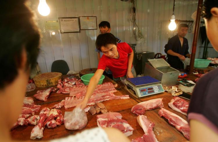 A vendor sells pork at a meat market in Xian of Shaanxi Province, China. A large-scale outbreak of hog cholera in Zhejiang Province over the past two months has been ignored by officials, say locals. (China Photos/Getty Images) A vendor sells pork at a meat market in Xian of Shaanxi Province, China. A large-scale outbreak of hog cholera in Zhejiang Province over the past two months has been ignored by officials, say locals. (China Photos/Getty Images)