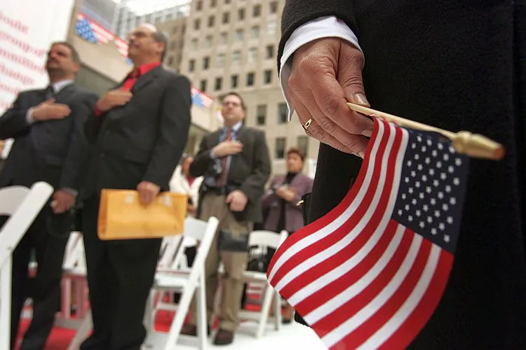 Attendees stand for the Pledge of Allegiance during a swearing-in ceremony for new U.S. citizens in New York City. (Spencer Platt/Getty Images) 