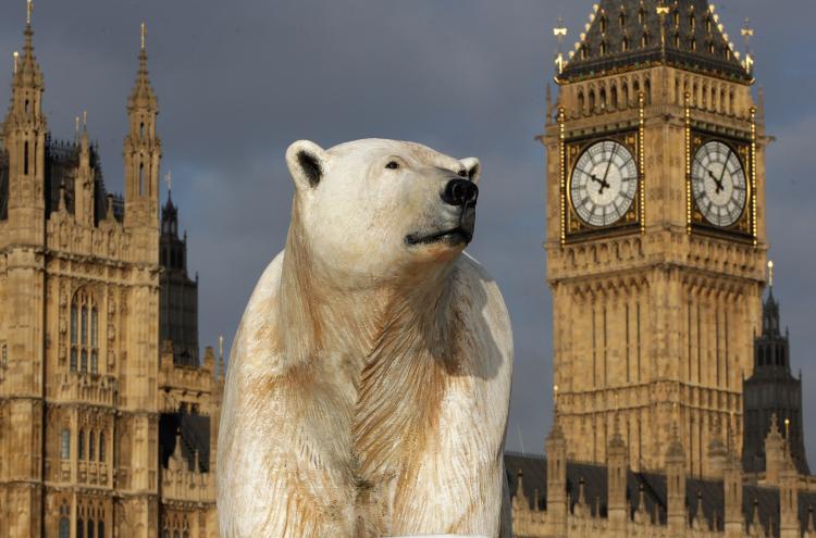 A 16-foot-high sculpture of a polar bear and cub, afloat on a small iceberg, passes in front of the Houses of Parliament on the River Thames in London, January 2009. (Oli Scarff/Getty Images) A 16-foot-high sculpture of a polar bear and cub, afloat on a small iceberg, passes in front of the Houses of Parliament on the River Thames in London, January 2009. (Oli Scarff/Getty Images)