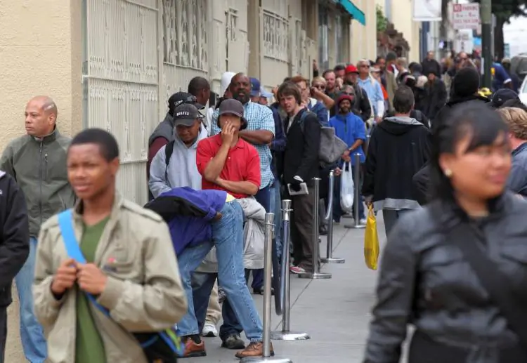 People line up to receive a free meal at the St. Anthony foundation dining room in San Francisco, Calif., on Sept. 16, 2010. (Justin Sullivan/Getty Images)