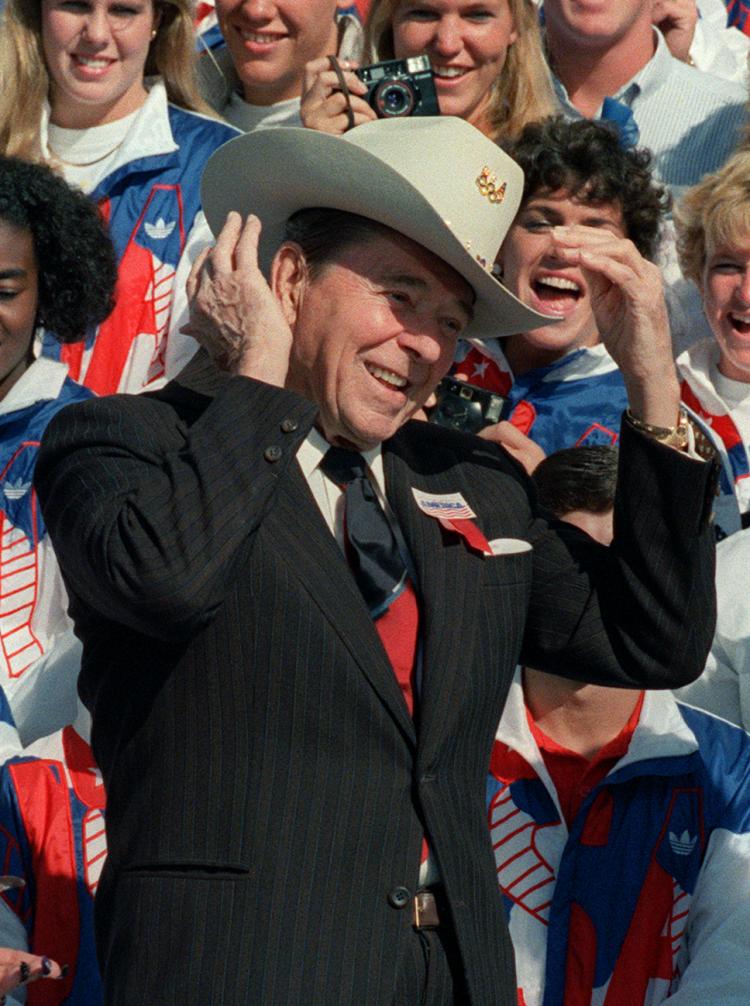 THE GIPPER: President Ronald Reagan tries on an Olympic cowboy hat on the South Lawn of the White House in Oct. 1988 during a ceremony honoring the U.S. Olympic team.  (Mike Sargent/Getty Images )