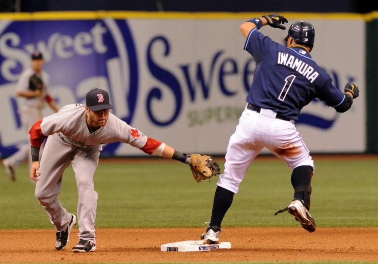 BEAT THE TAG: The Rays may have won some small battles against the Red Sox but Boston is in the driver's seat for the wild card. (Al Messerschmidt/Getty Images) BEAT THE TAG: The Rays may have won some small battles against the Red Sox but Boston is in the driver's seat for the wild card. (Al Messerschmidt/Getty Images)