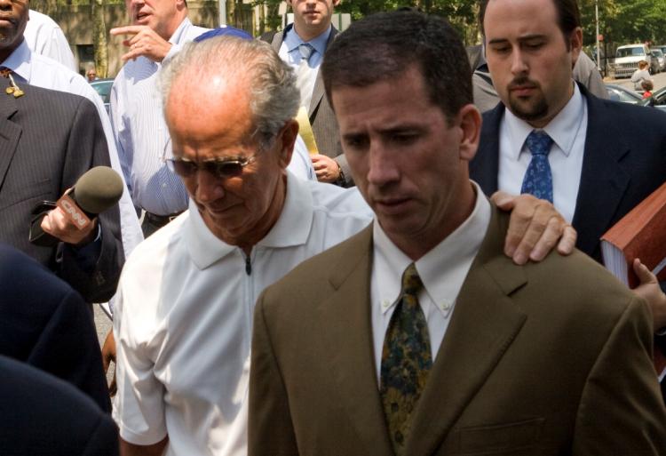 FOUL PLAY: Gerry Donaghy comforts his son, ex-NBA Referee Tim Donaghy, as they leave Brooklyn Federal Courthouse on July 29. Tim Donaghy was sentenced to 15 months of prison for betting on games he refereed. (Mimi Li/The Epoch Times) FOUL PLAY: Gerry Donaghy comforts his son, ex-NBA Referee Tim Donaghy, as they leave Brooklyn Federal Courthouse on July 29. Tim Donaghy was sentenced to 15 months of prison for betting on games he refereed. (Mimi Li/The Epoch Times)