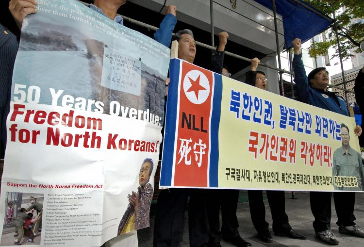 South Korean conservative activists stage an anti-North korea rally outside a state human rights committee in Seoul, 18 October 2007, denouncing human rights abuses in North Korea. (Jung Yeon-Je/AFP/Getty Images)