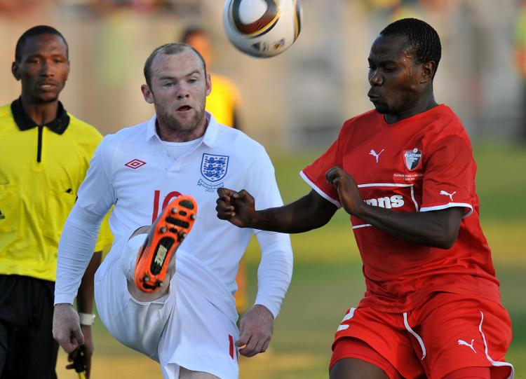 Wayne Rooney (L) in action against Platinum Stars on Monday. (Jung Yeon-Je/AFP/Getty Images) Wayne Rooney (L) in action against Platinum Stars on Monday. (Jung Yeon-Je/AFP/Getty Images)