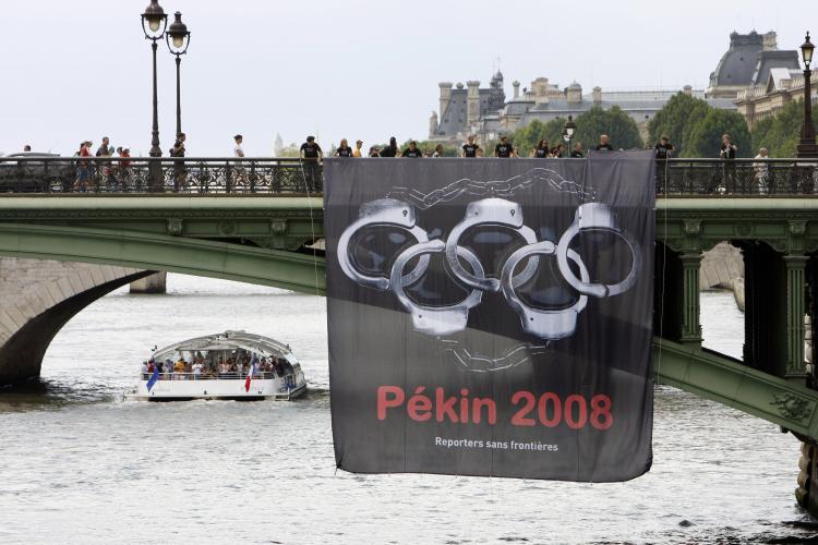 Human rights in China are deteriorating in the lead-up to the Olympic Games, say rights organizations, as Beijing authorities round up dissidents and members of persecuted groups to hide them from the media throng now descending on Beijing. (Bertrand Guay/AFP/Getty Images) Human rights in China are deteriorating in the lead-up to the Olympic Games, say rights organizations, as Beijing authorities round up dissidents and members of persecuted groups to hide them from the media throng now descending on Beijing. (Bertrand Guay/AFP/Getty Images)