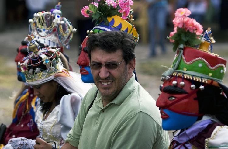 File picture taken on January 16, 2009 shows French director Christian Poveda (C) during an assignment in San Salvador. (Jose Cabezas/AFP/Getty Images) File picture taken on January 16, 2009 shows French director Christian Poveda (C) during an assignment in San Salvador. (Jose Cabezas/AFP/Getty Images)