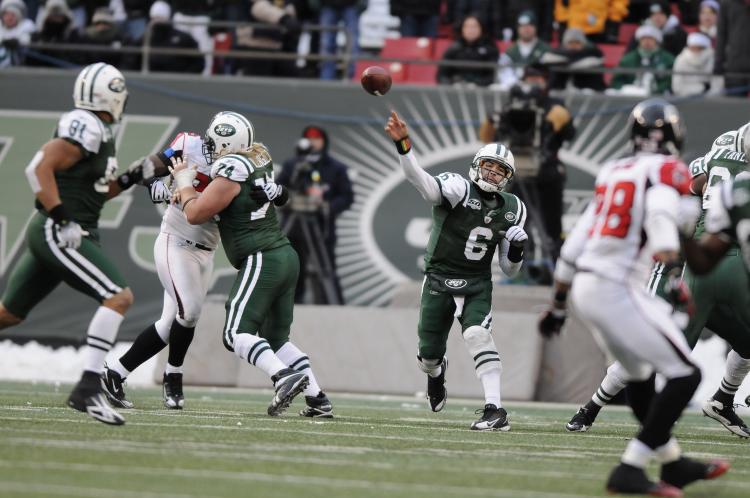 Jets QB Mark Sanchez didn't hold back against the Falcons but he did not enjoy much success. (Jim Luzzi/Getty Images)