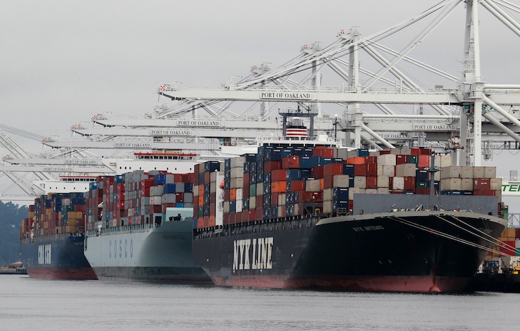 Container ships are positioned under cranes at the Port of Oakland, Calif., on Aug. 16, 2010, Multinational companies use China as a platform for producing goods to ship back to the United States, which has caused great loss of jobs here. (Justin Sullivan/Getty Images) Container ships are positioned under cranes at the Port of Oakland, Calif., on Aug. 16, 2010, Multinational companies use China as a platform for producing goods to ship back to the United States, which has caused great loss of jobs here. (Justin Sullivan/Getty Images)
