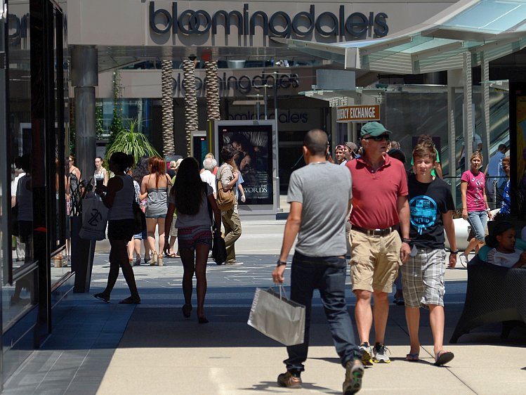 Shoppers walk through the Santa Monica Place mall on Aug. 17, in Santa Monica, Calif. Consumer sentiment unexpectedly rose in September to the highest level since February, according to a survey published by the Conference Board. (Kevork Djansezian/Getty Images) 