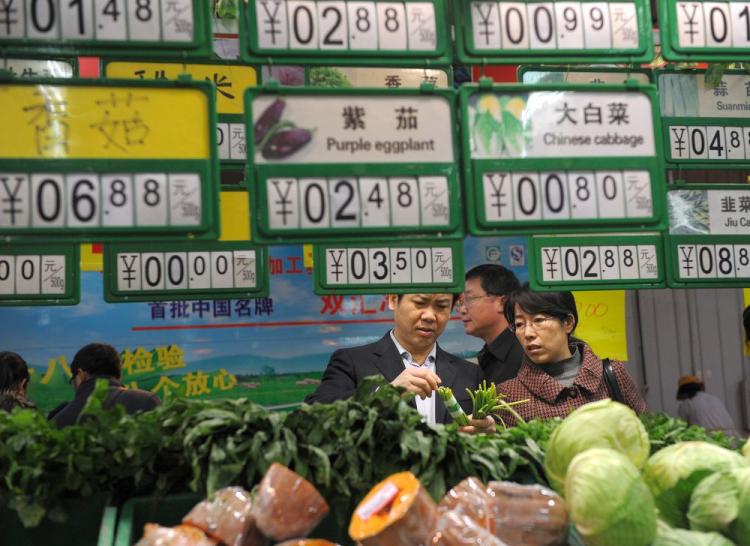 Chinese shoppers gather to buy vegetables at a supermarket in Hefei, east China Anhui province on Dec. 10, 2010. China's consumer prices rose at the fastest pace in more than two years in November. (STR/AFP/Getty Images) Chinese shoppers gather to buy vegetables at a supermarket in Hefei, east China Anhui province on Dec. 10, 2010. China's consumer prices rose at the fastest pace in more than two years in November. (STR/AFP/Getty Images)