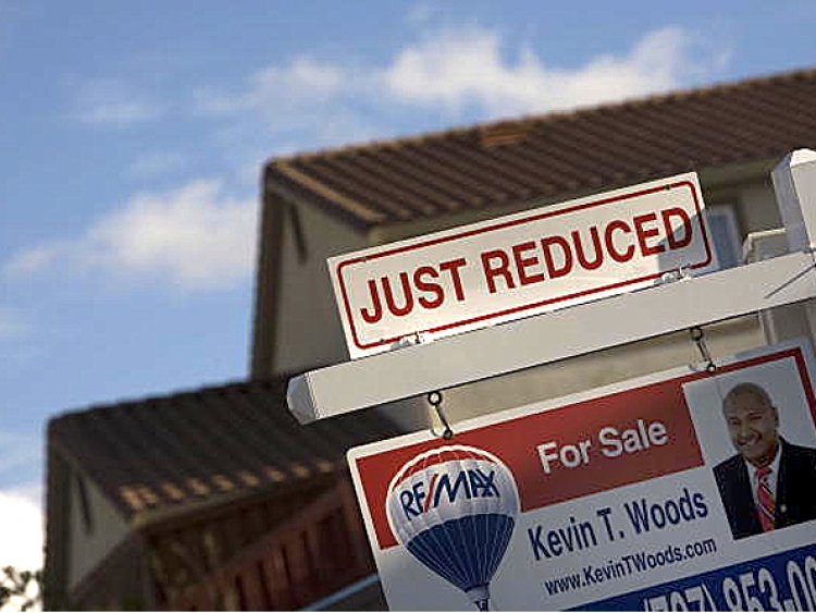 Home prices are dropping around the nation, which makes this a great time for buyers. (David Paul Morris/Getty Images)